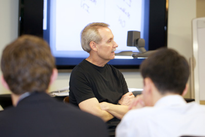 Gary Keller presenting in a room with students