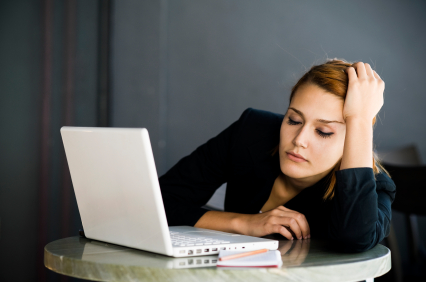 Stock photo of tired businesswoman